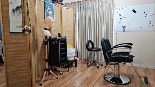 Wide view of the barbering studio with equipment and styling tools
